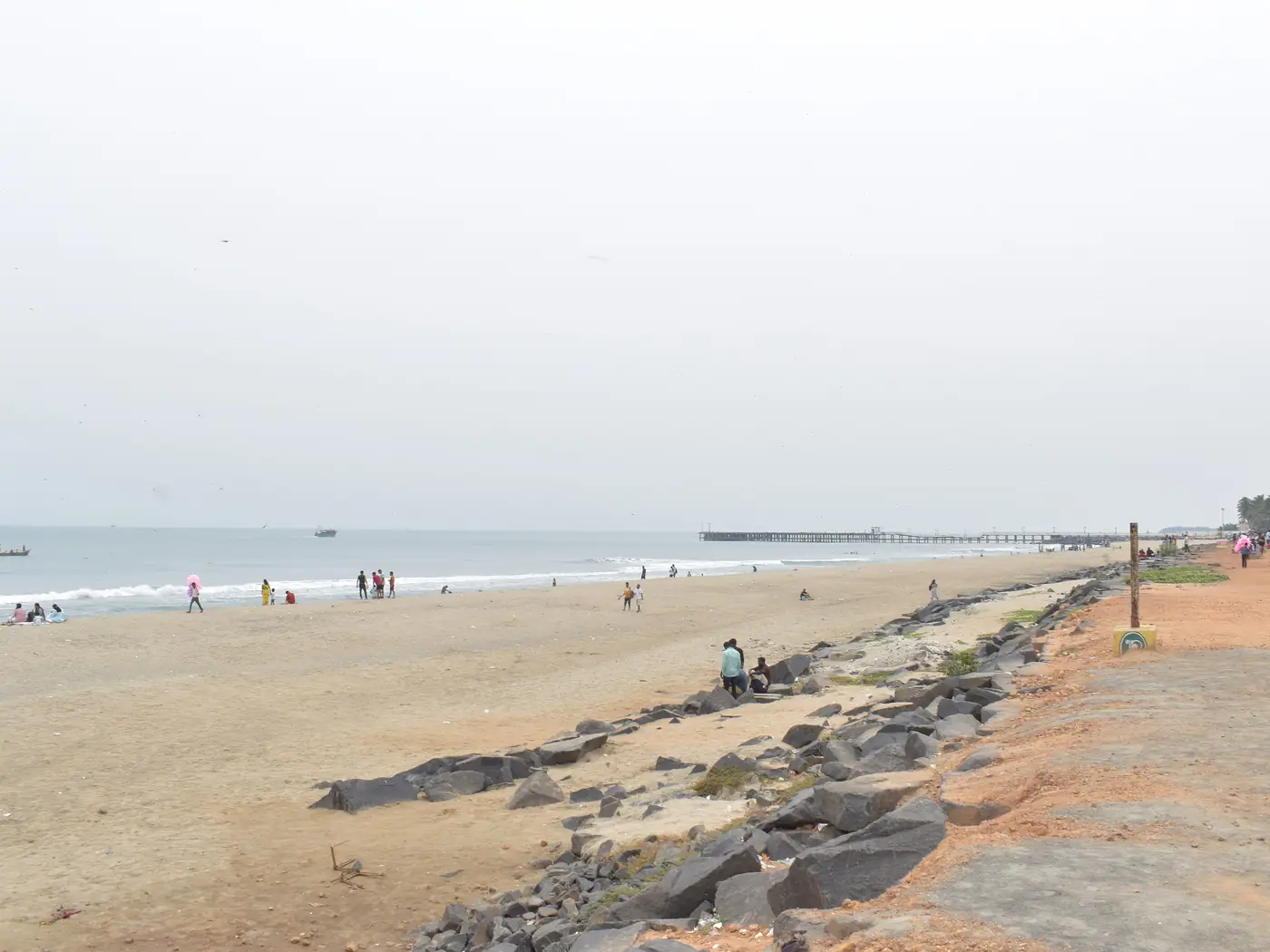 Rock Beach with its stone breakwater and the pier in the distance