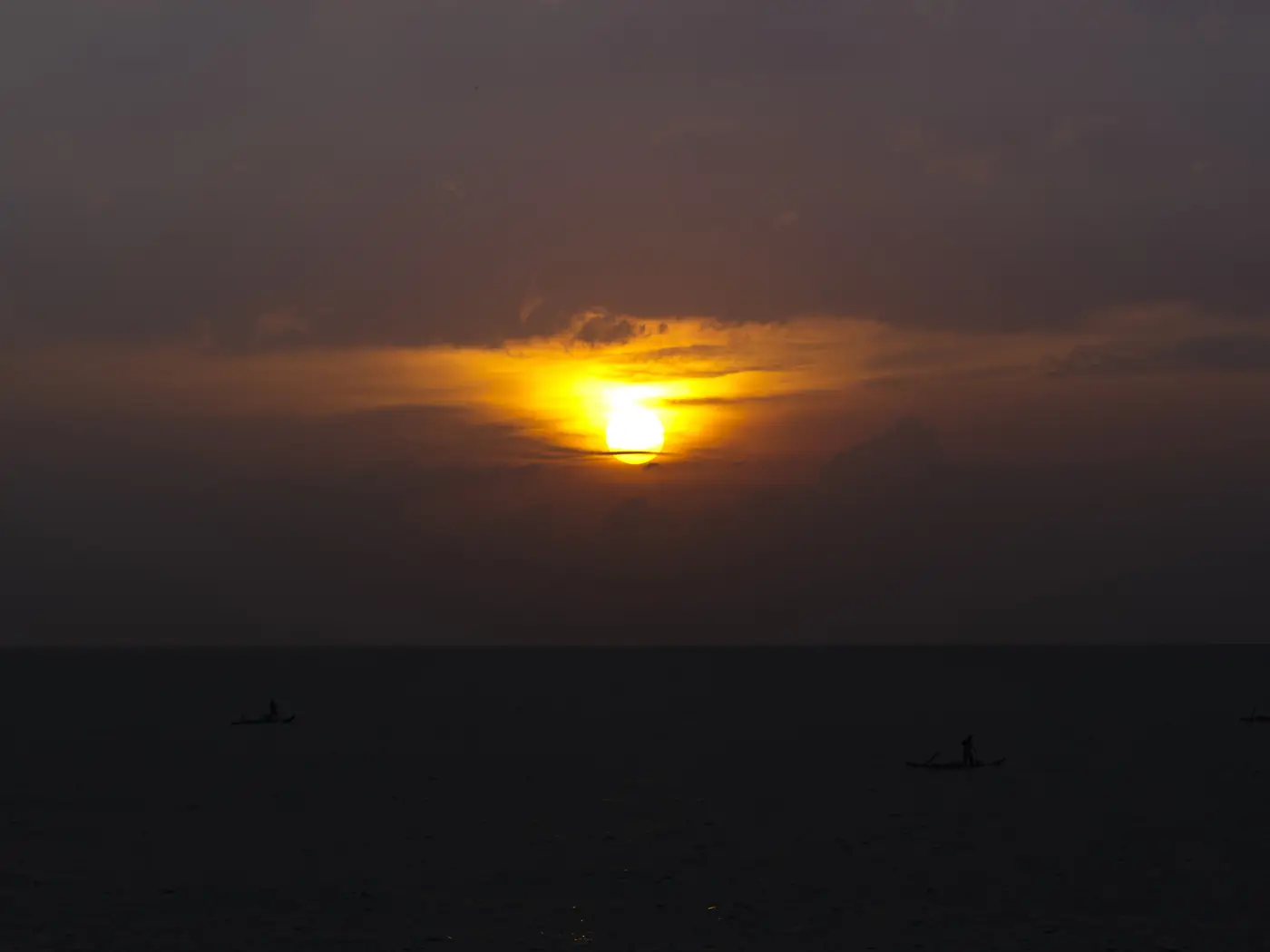 Sunrise over the Bay of Bengal with boats, off Pondicherry